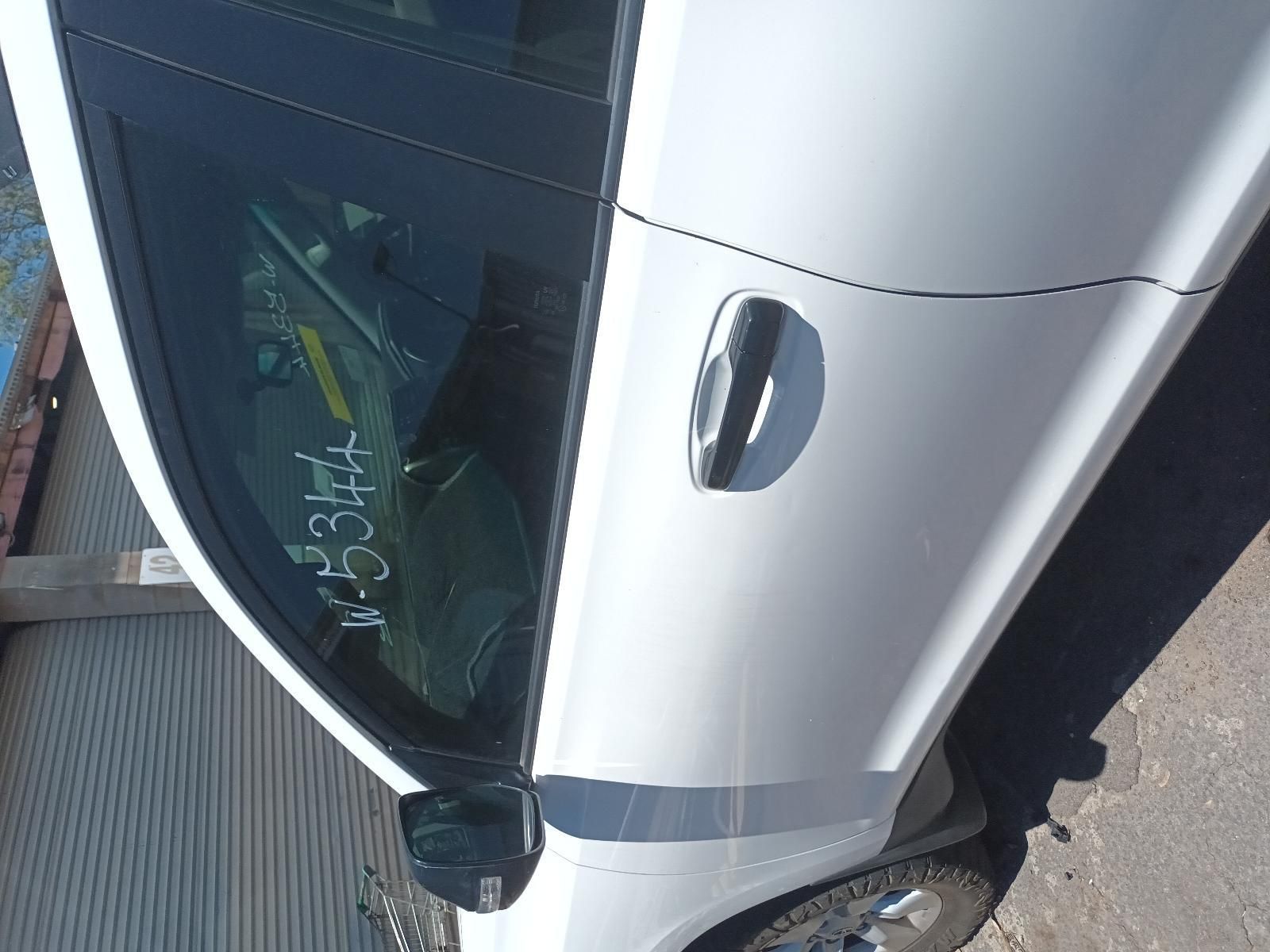 White Car Parked Beside a Building — South West 4WD Wreckers In Harristown, QLD