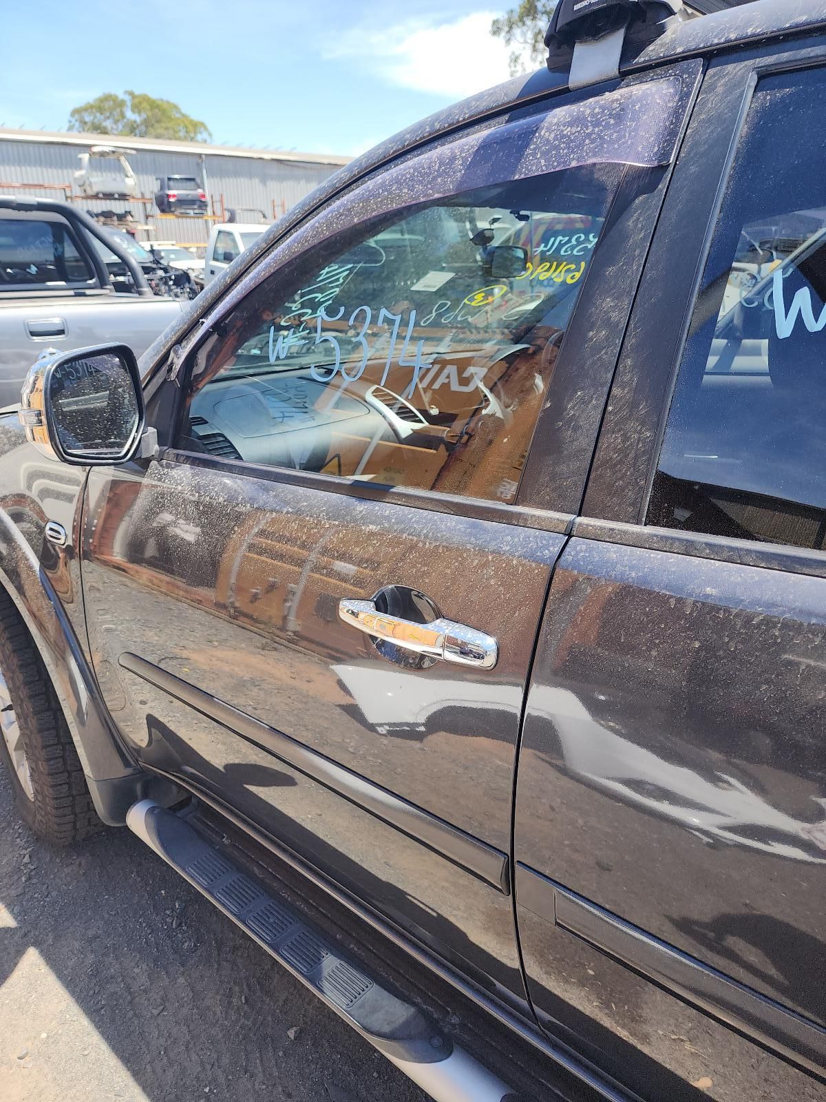 Black Pickup Truck With a Broken Driver-side Window — South West 4WD Wreckers In Harristown, QLD