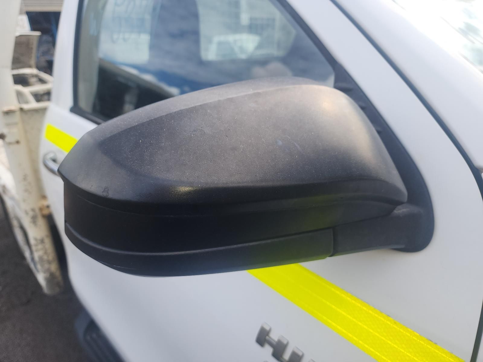 Close-up of a Black Side Mirror on a White Car With a Yellow Stripe — South West 4WD Wreckers In Harristown, QLD
