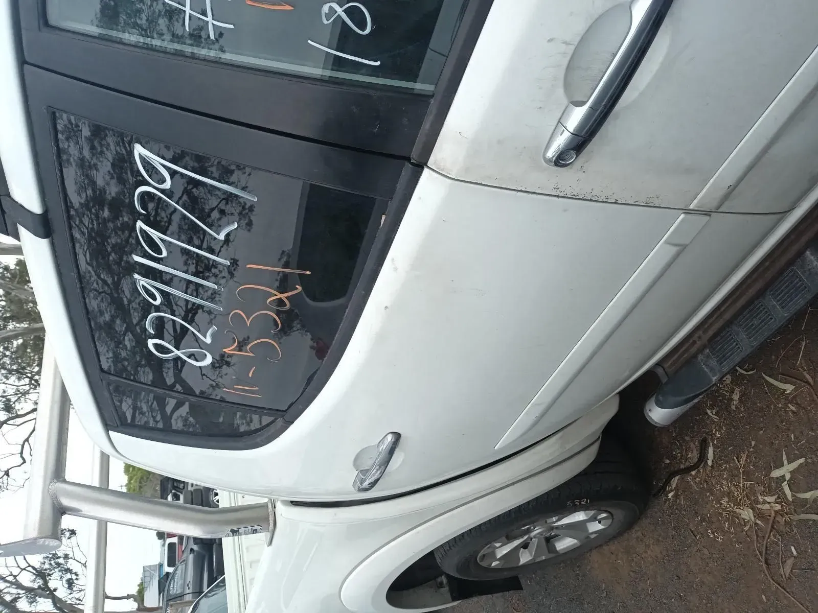White Car Door With Price Markings on the Window — South West 4WD Wreckers In Harristown, QLD