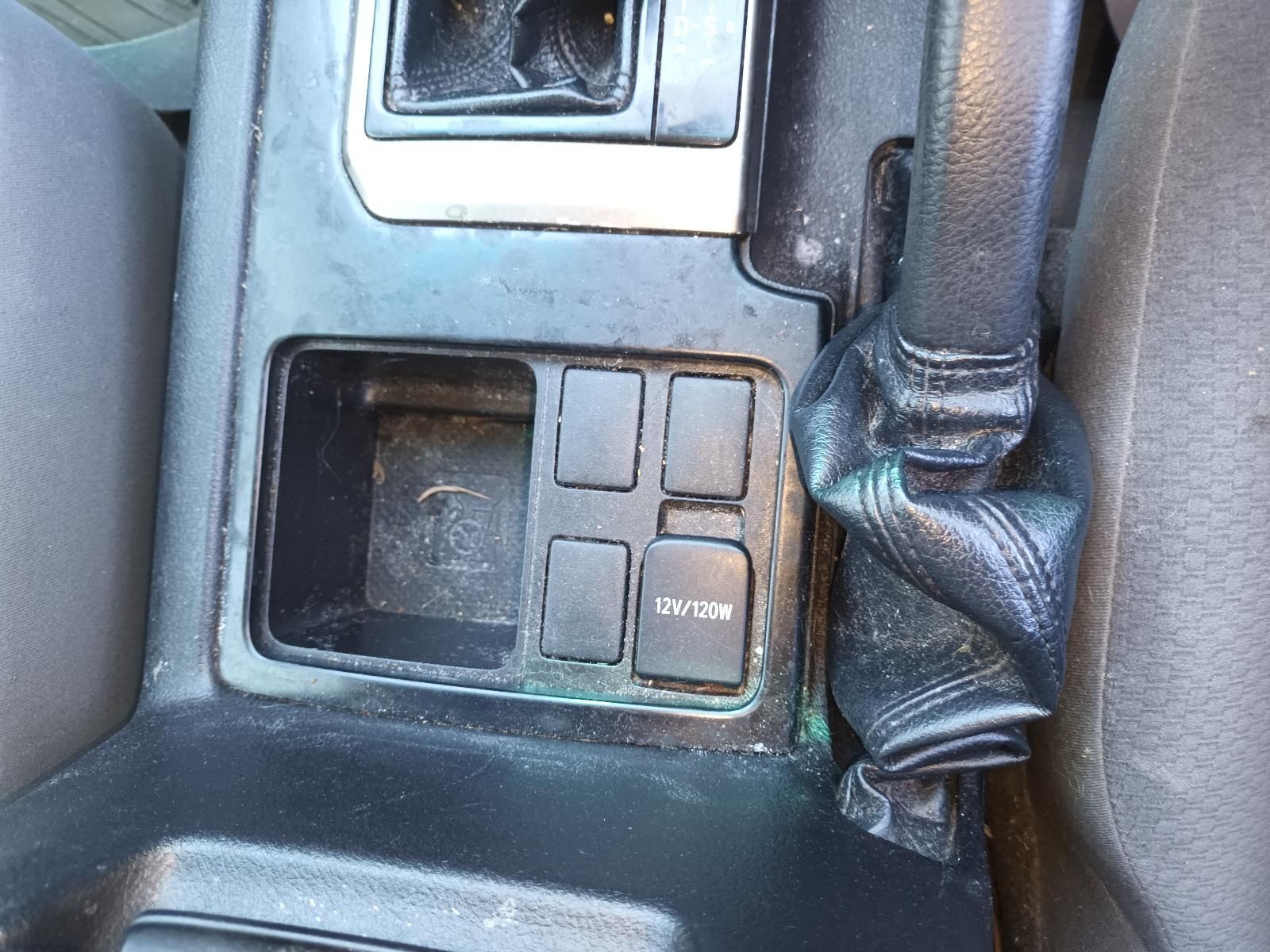 Close-up of a car centre console with an open storage compartment — South West 4WD Wreckers In Harristown, QLD