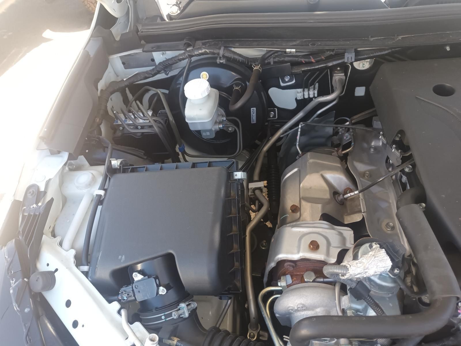 Open Car Engine Bay with Black Air Box, Coolant Reservoir — South West 4WD Wreckers In Harristown, QLD