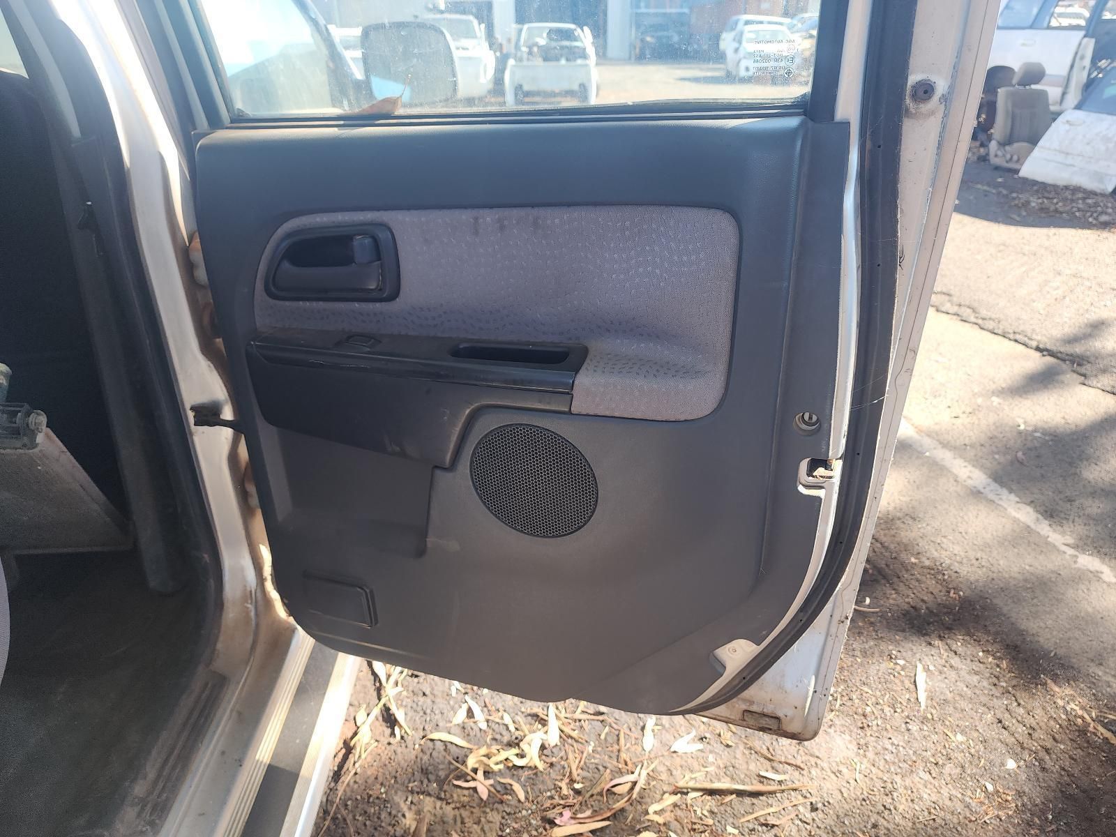 Open Car Door Showing Gray Interior Panel with Speaker and Window Control — South West 4WD Wreckers In Harristown, QLD