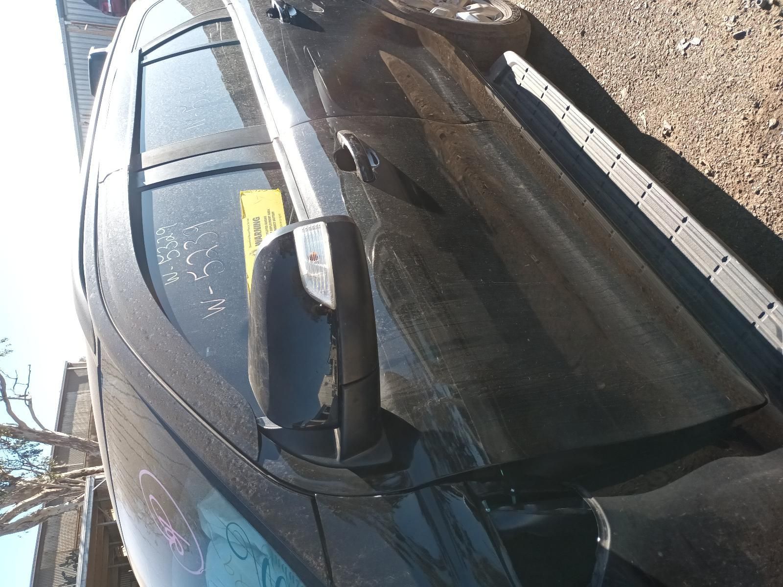 Top-Down View of A Dark Car Parked on Gravel Beside a Curb — South West 4WD Wreckers In Harristown, QLD