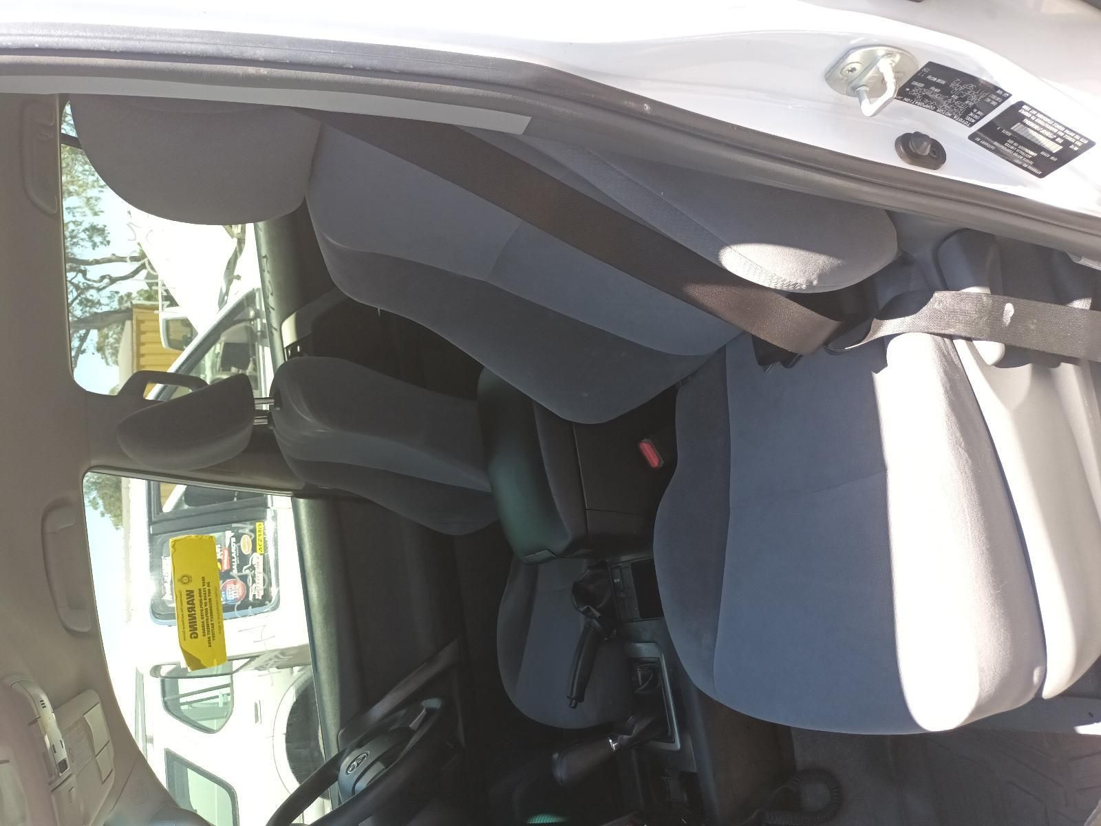 Interior of A Car with The Driver Door Open, Showing Grey Seats — South West 4WD Wreckers In Harristown, QLD