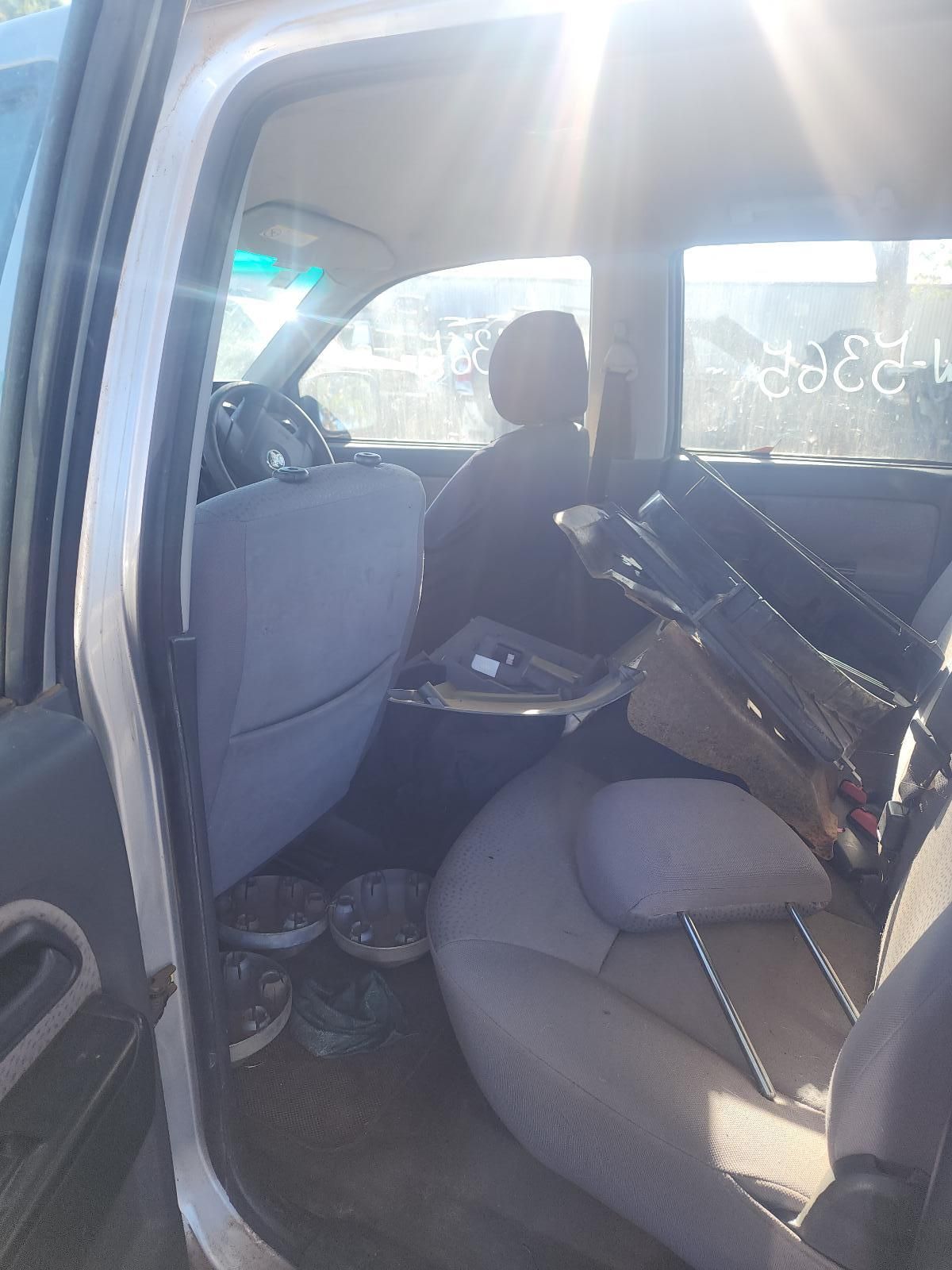 Inside a Car, a Gray Front Passenger Seat and Steering Wheel Are Visible — South West 4WD Wreckers In Harristown, QLD
