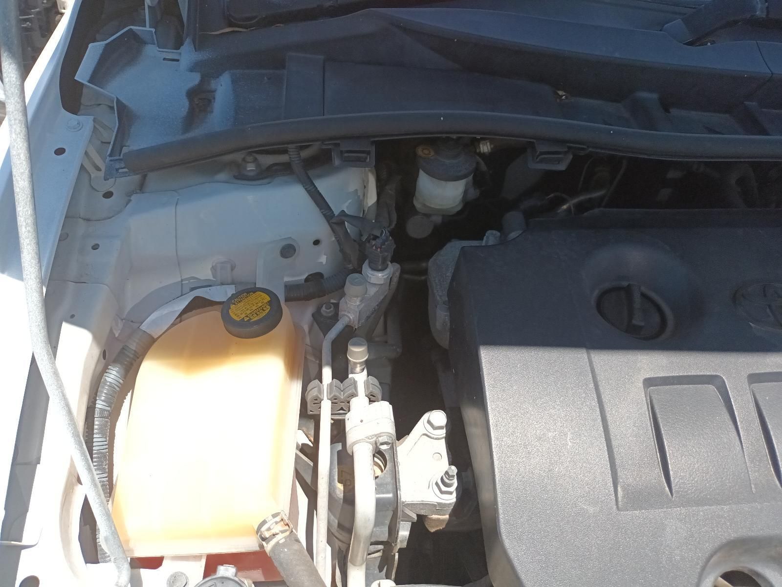 Car Engine Bay with Coolant Reservoir and Engine Cover, Viewed from Above — South West 4WD Wreckers In Harristown, QLD