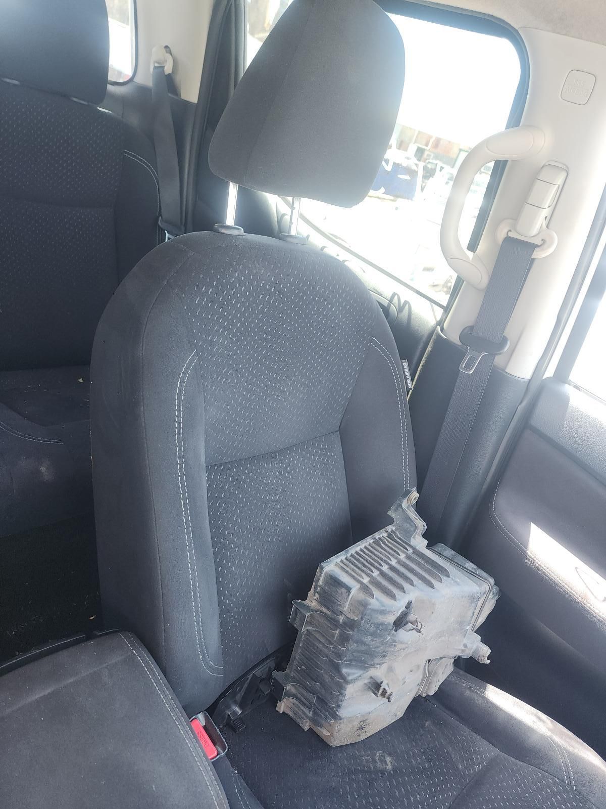 Car Seat With a Black Electronic Device Resting — South West 4WD Wreckers In Harristown, QLD