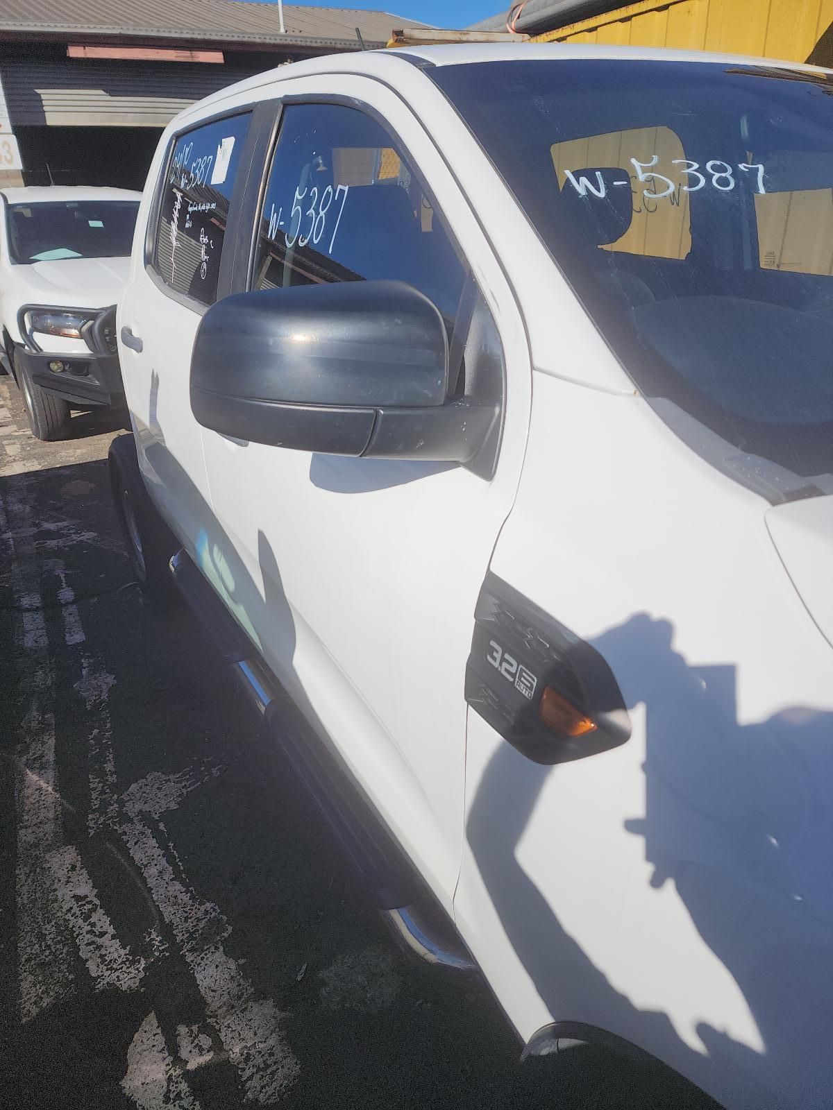 White Pickup Truck Parked on a Sunny Lot — South West 4WD Wreckers In Harristown, QLD