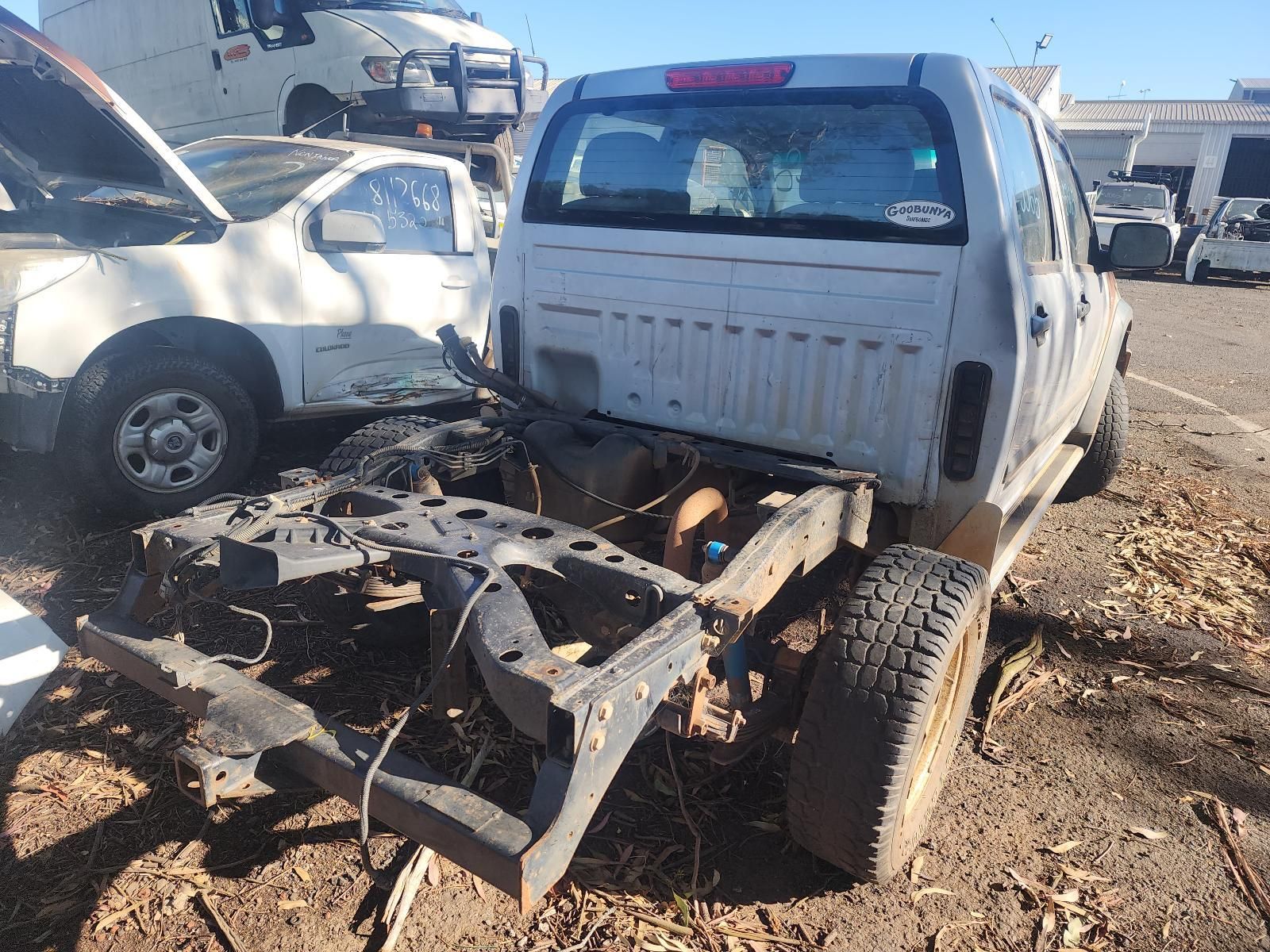 White Pickup Truck with A Damaged Front End in A Junkyard — South West 4WD Wreckers In Harristown, QLD