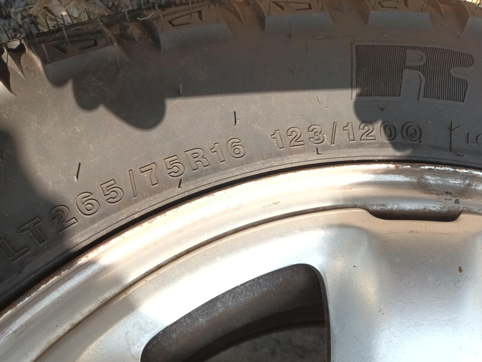 Close-Up of A Tyre Sidewall and Silver Wheel Rim with Embossed Size Markings — South West 4WD Wreckers In Harristown, QLD
