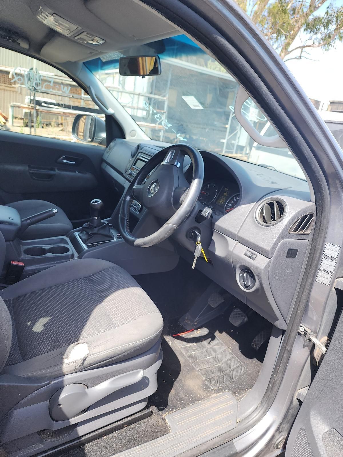 Car Interior With Driver’s Door Open, Gray Seats — South West 4WD Wreckers In Harristown, QLD