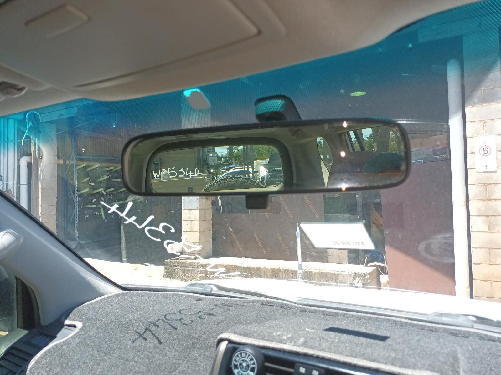 Car Interior Facing a Storefront Through the Windshield — South West 4WD Wreckers In Harristown, QLD