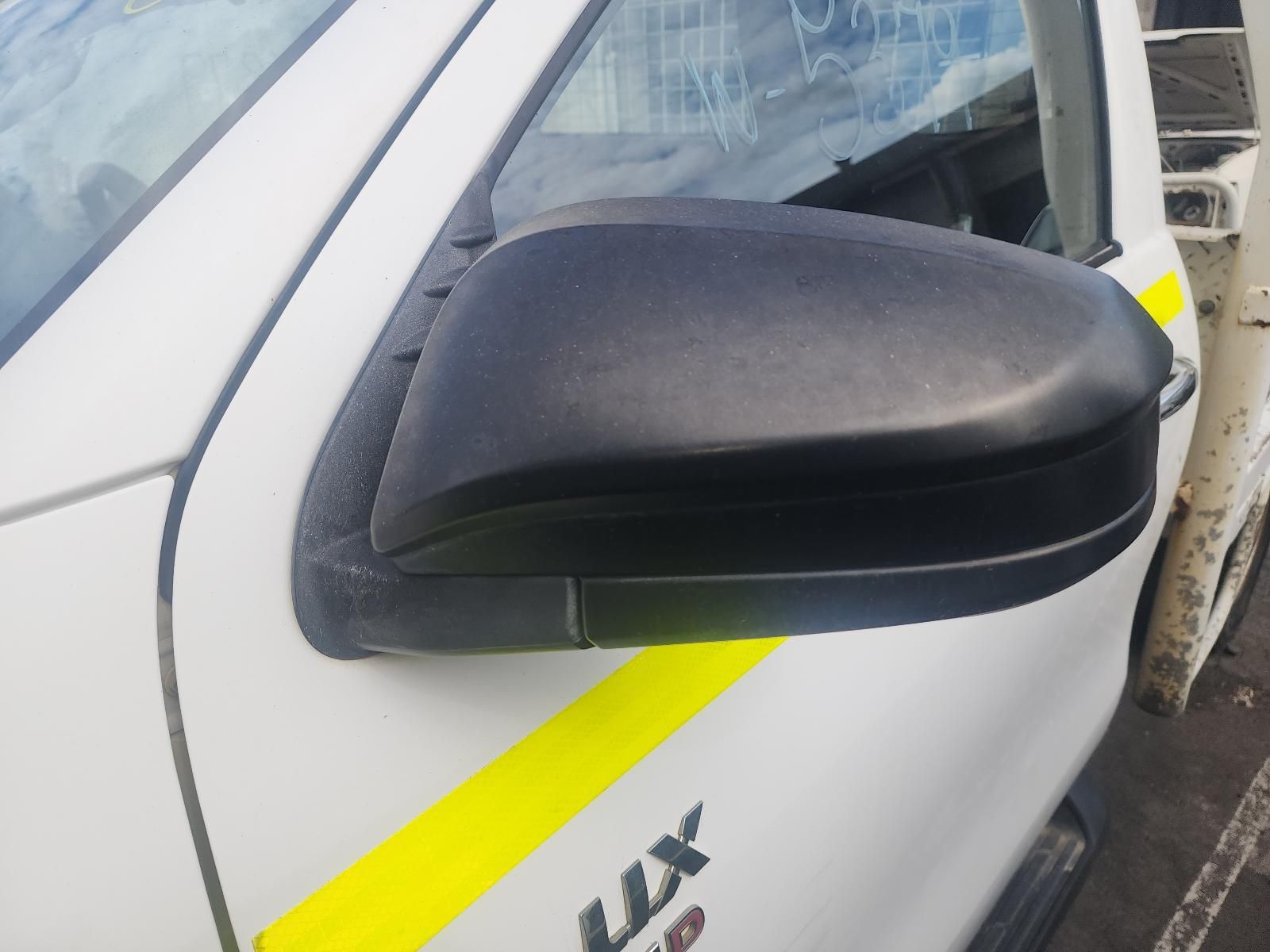 Close-up of a Black Side Mirror on a White Car — South West 4WD Wreckers In Harristown, QLD