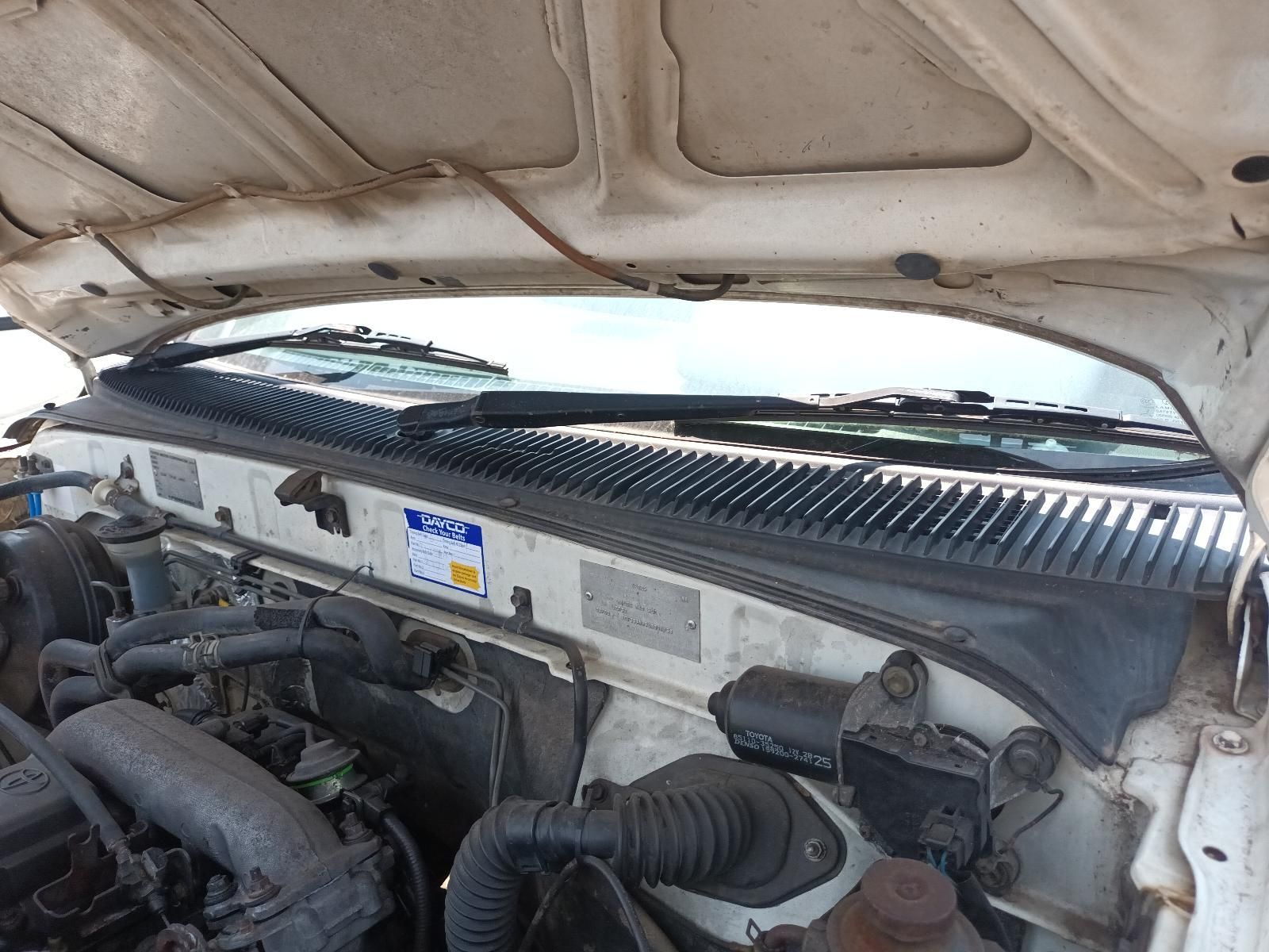 Truck Engine Bay with Hood Open, Showing Hoses, Air Intake, and Windshield Cowl — South West 4WD Wreckers In Harristown, QLD