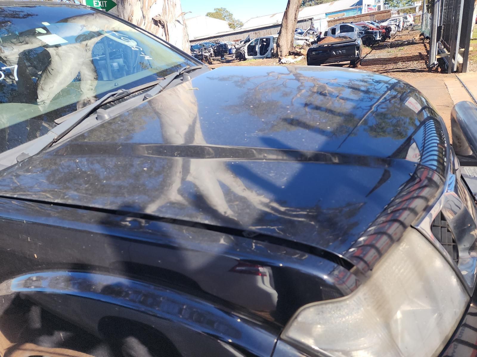 Damaged Black Car Hood — South West 4WD Wreckers In Harristown, QLD