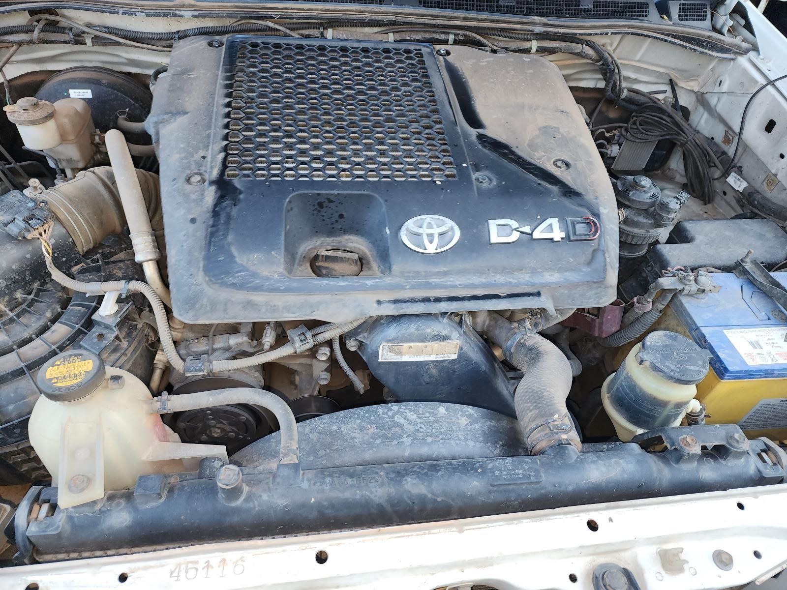 Dusty Toyota C-4 Engine Bay Under the Hood of a Vehicle — South West 4WD Wreckers In Harristown, QLD