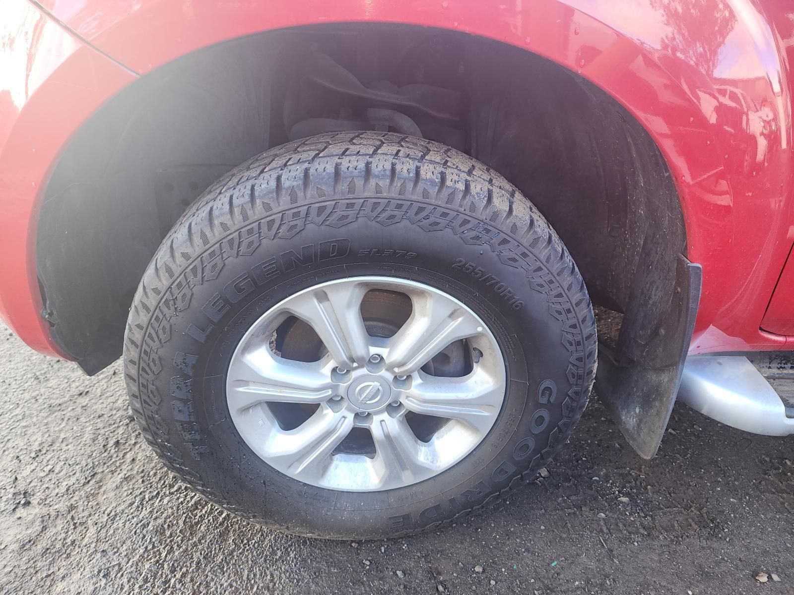 Close-up of a Red SUV’s Rear Wheel — South West 4WD Wreckers In Harristown, QLD