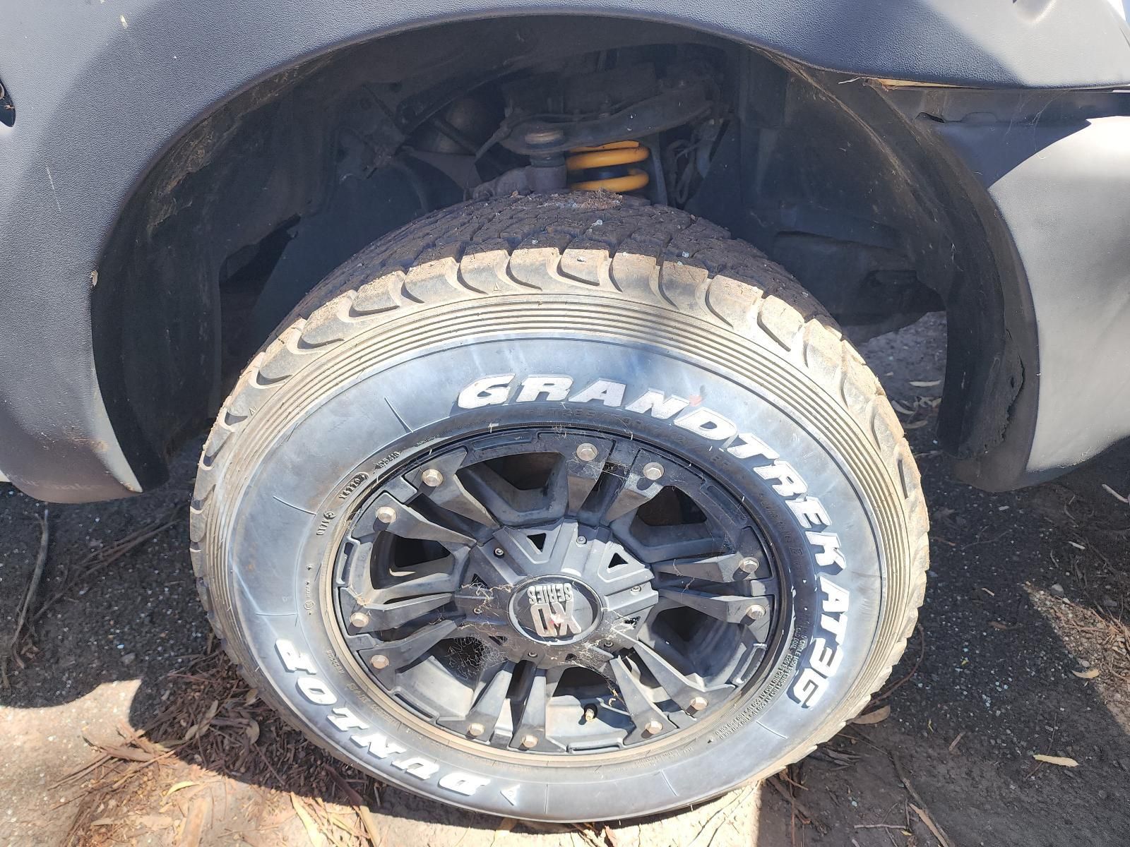 Close-up of a Car’s Rear Wheel — South West 4WD Wreckers In Harristown, QLD