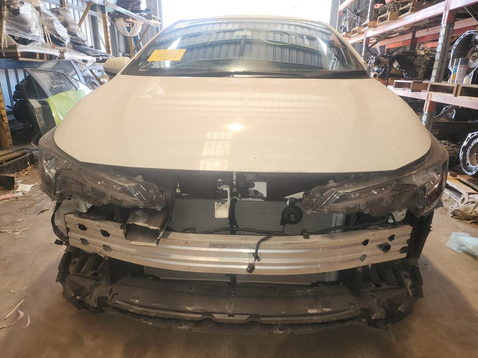 Front View of a Damaged White Car — South West 4WD Wreckers In Harristown, QLD