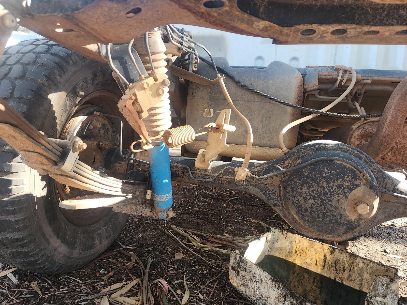 Close-Up of A Dusty Off-Road Vehicle Suspension and Tire — South West 4WD Wreckers In Harristown, QLD