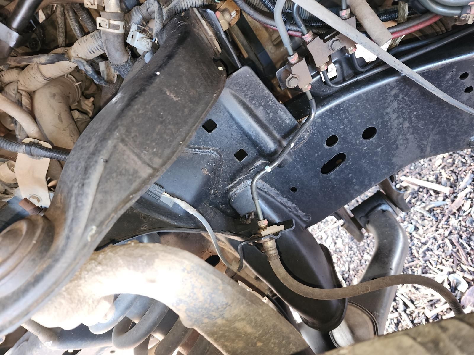 Close-up of a Car’s Exposed Undercarriage — South West 4WD Wreckers In Harristown, QLD