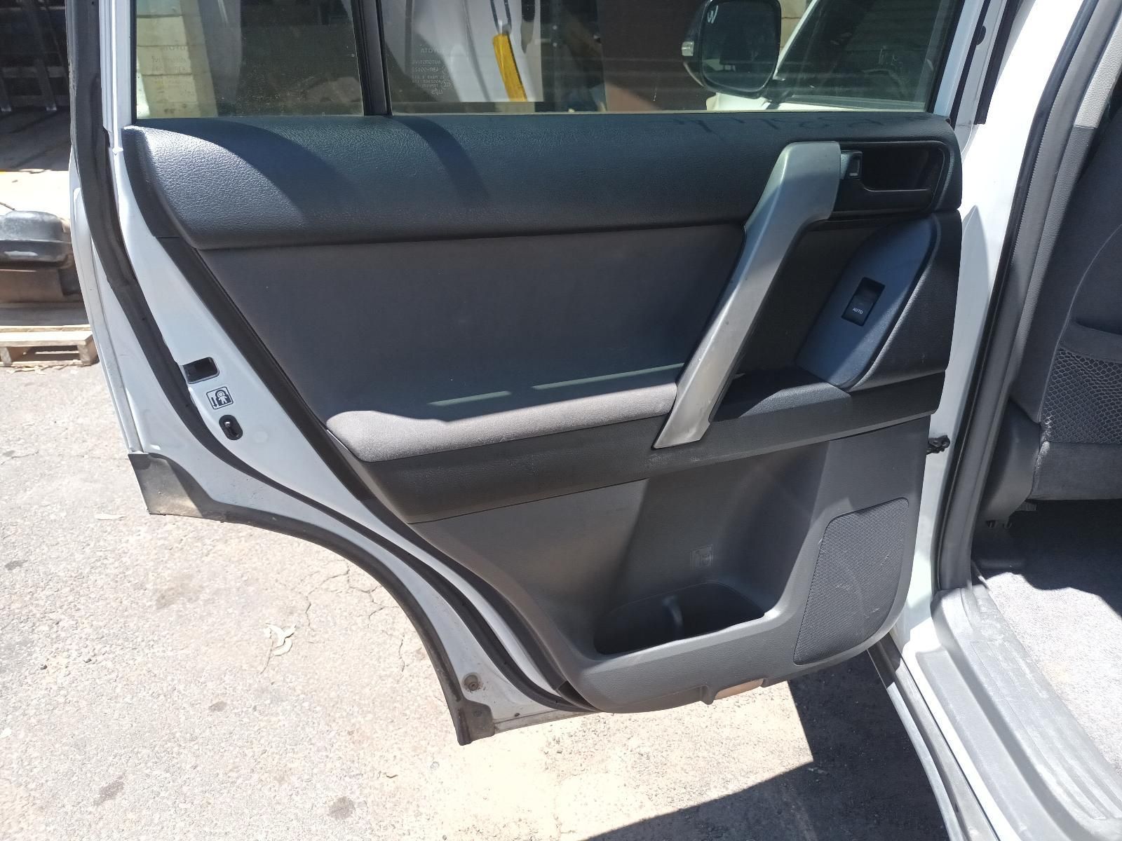 Open Car Rear Door Showing Black Interior Panel and Silver Trim in Daylight — South West 4WD Wreckers In Harristown, QLD