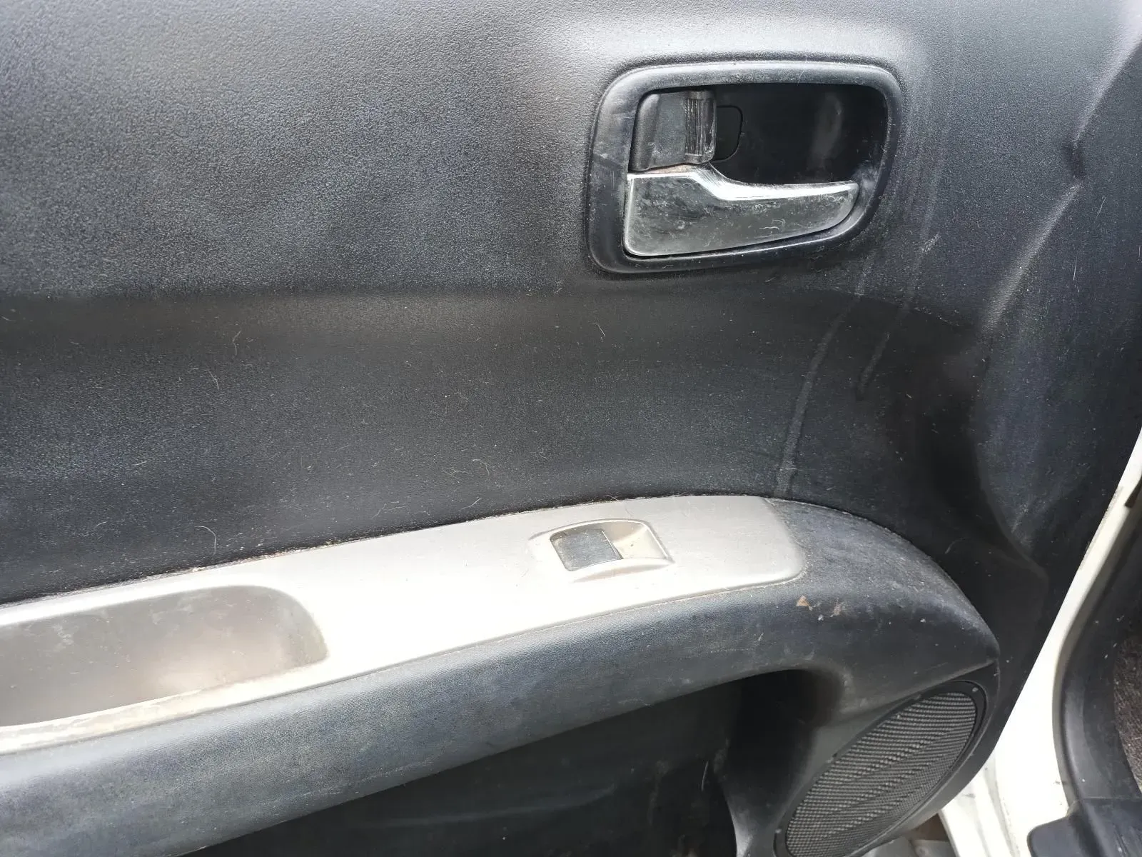 Car Door Interior, Showing Door Handle, Window Control, and Speaker — South West 4WD Wreckers In Harristown, QLD