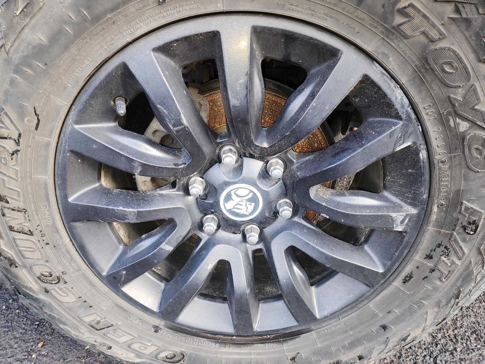 Black Alloy Car Wheel With a Toyota Center Cap — South West 4WD Wreckers In Harristown, QLD