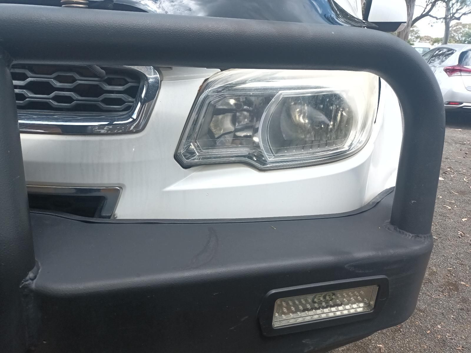 Front of A White Suv with A Black Grille Guard and Bumper Light — South West 4WD Wreckers In Harristown, QLD