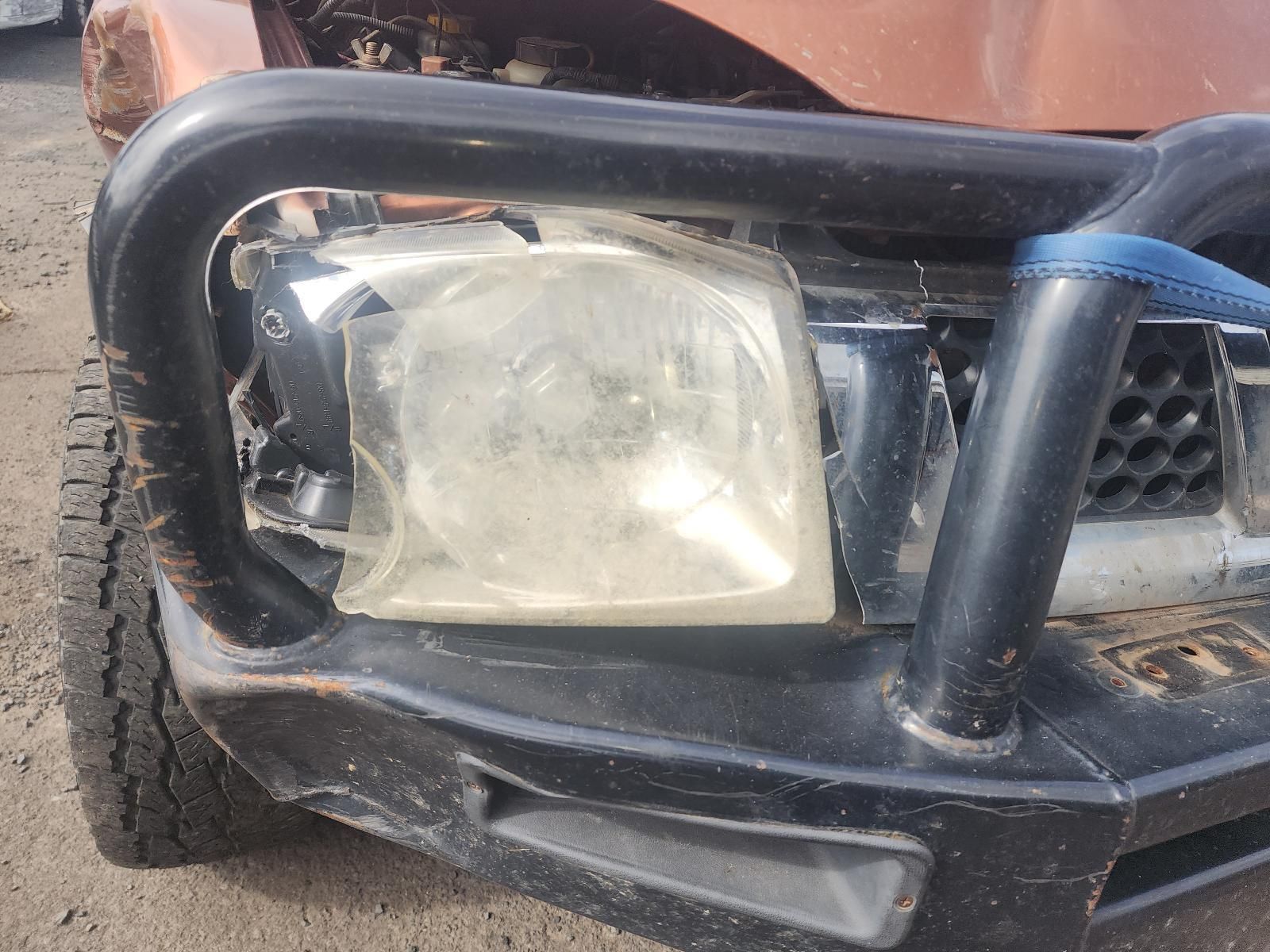 Damaged Car Front Bumper and Headlight — South West 4WD Wreckers In Harristown, QLD