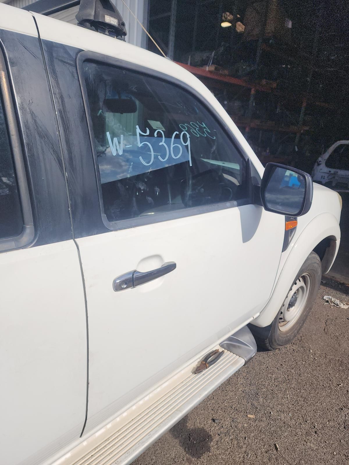 White Pickup Truck Parked on a Dirt Road — South West 4WD Wreckers In Harristown, QLD