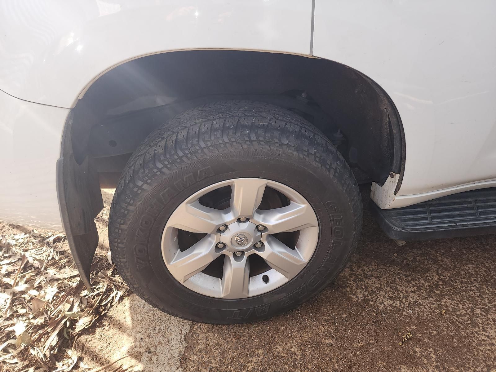 Close-up of a White SUV’s Front Wheel — South West 4WD Wreckers In Harristown, QLD