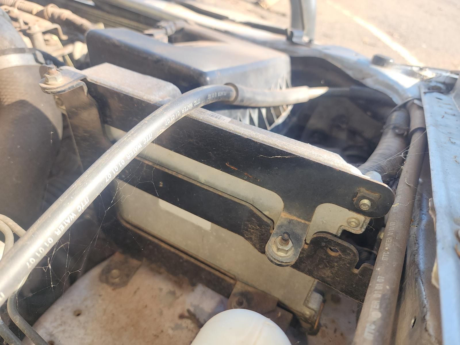Close-Up of A Car Engine Compartment with A Metal Bracket and Hoses — South West 4WD Wreckers In Harristown, QLD