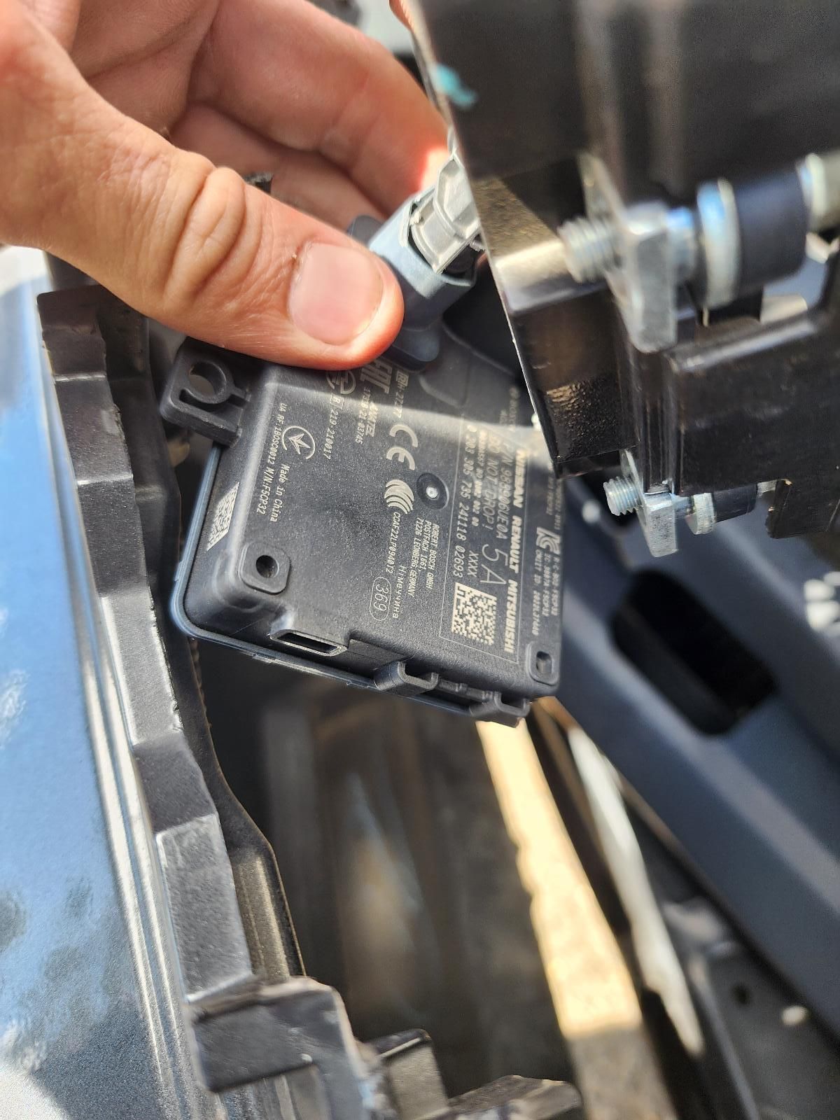 Hand Holding a Small Black Car — South West 4WD Wreckers In Harristown, QLD