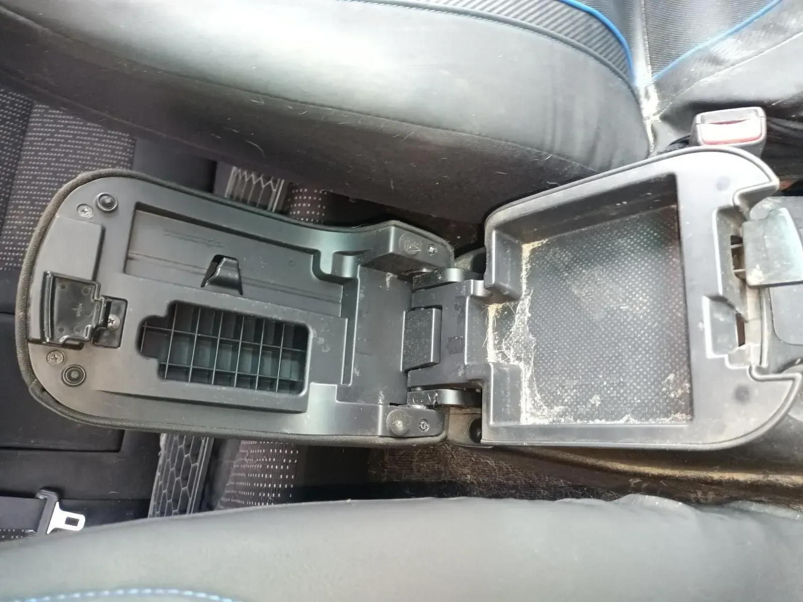 Open Car Center Console, Black Plastic, With Dust and Debris Inside — South West 4WD Wreckers In Harristown, QLD