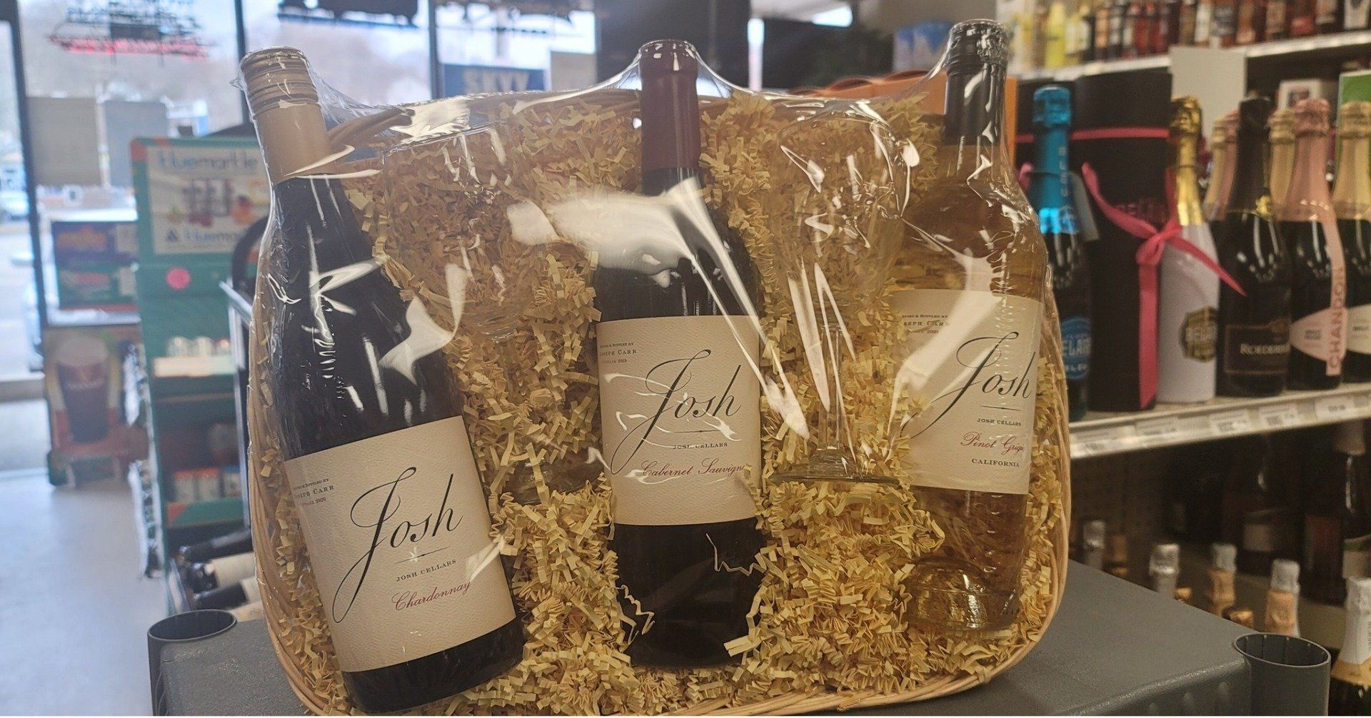 Gift basked with wine glasses and wines by Josh