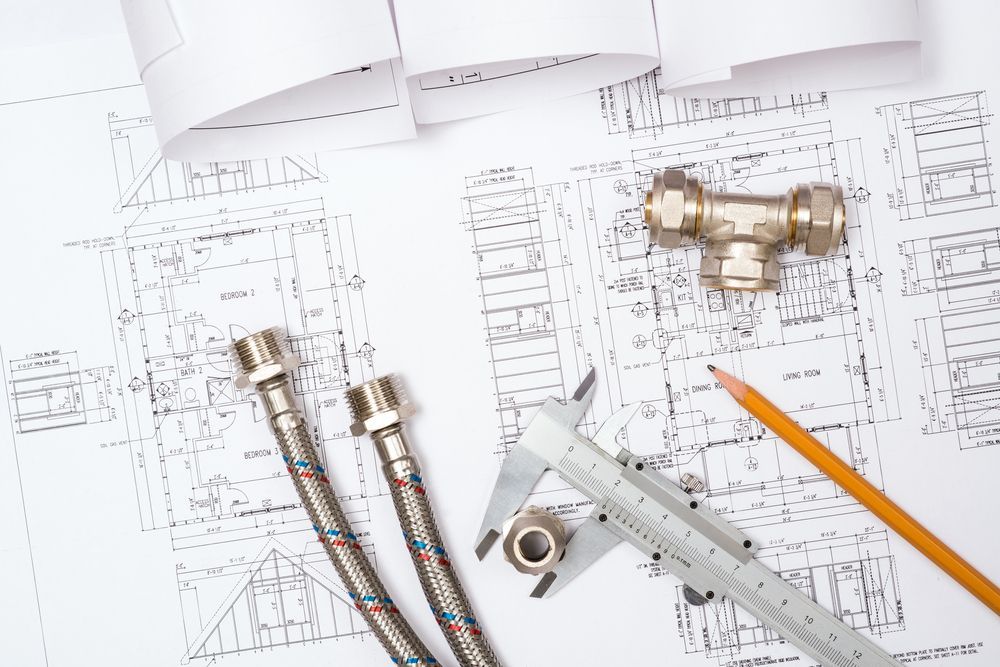 Plumbing Blueprints With Metal Fittings, Hoses, A Caliper, And Pencil — GS Design & Drafting In Rous, NSW