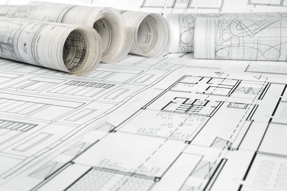 Architectural Blueprints, Rolled And Spread Out, Showing Detailed Floor Plans — GS Design & Drafting In Rous, NSW