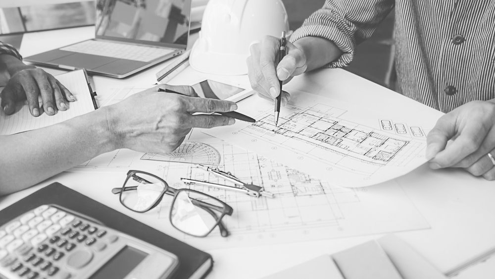 Architectural Blueprints, Rolled And Spread Out, Displaying Detailed Floor Plans — GS Design & Drafting In Rous, NSW