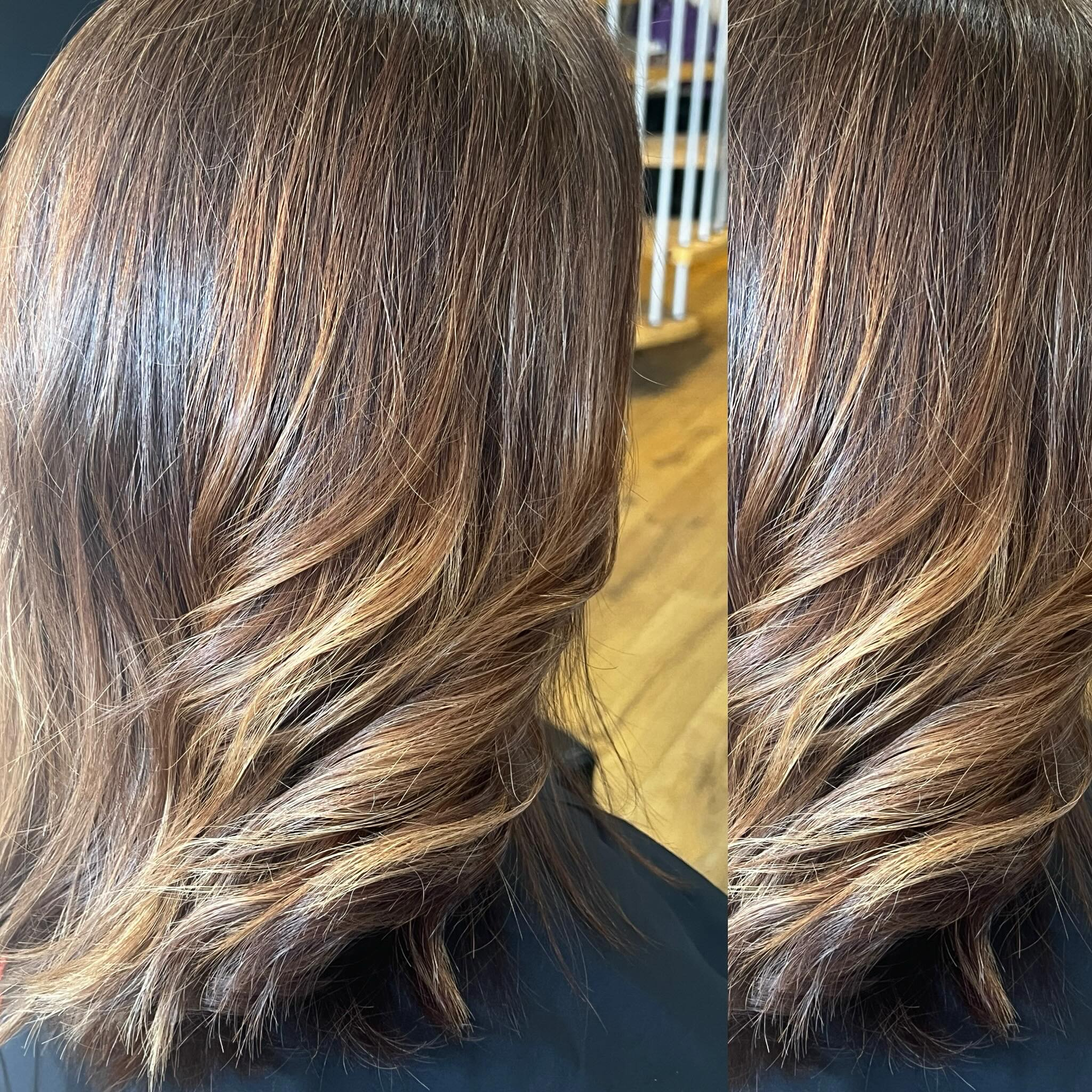 Close-up of dark brown hair with soft golden highlights and loose curls from the back