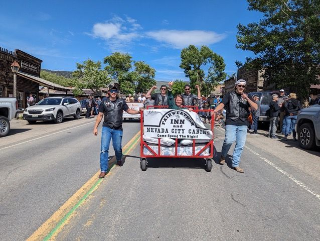 A group of men are walking down a street in a parade.