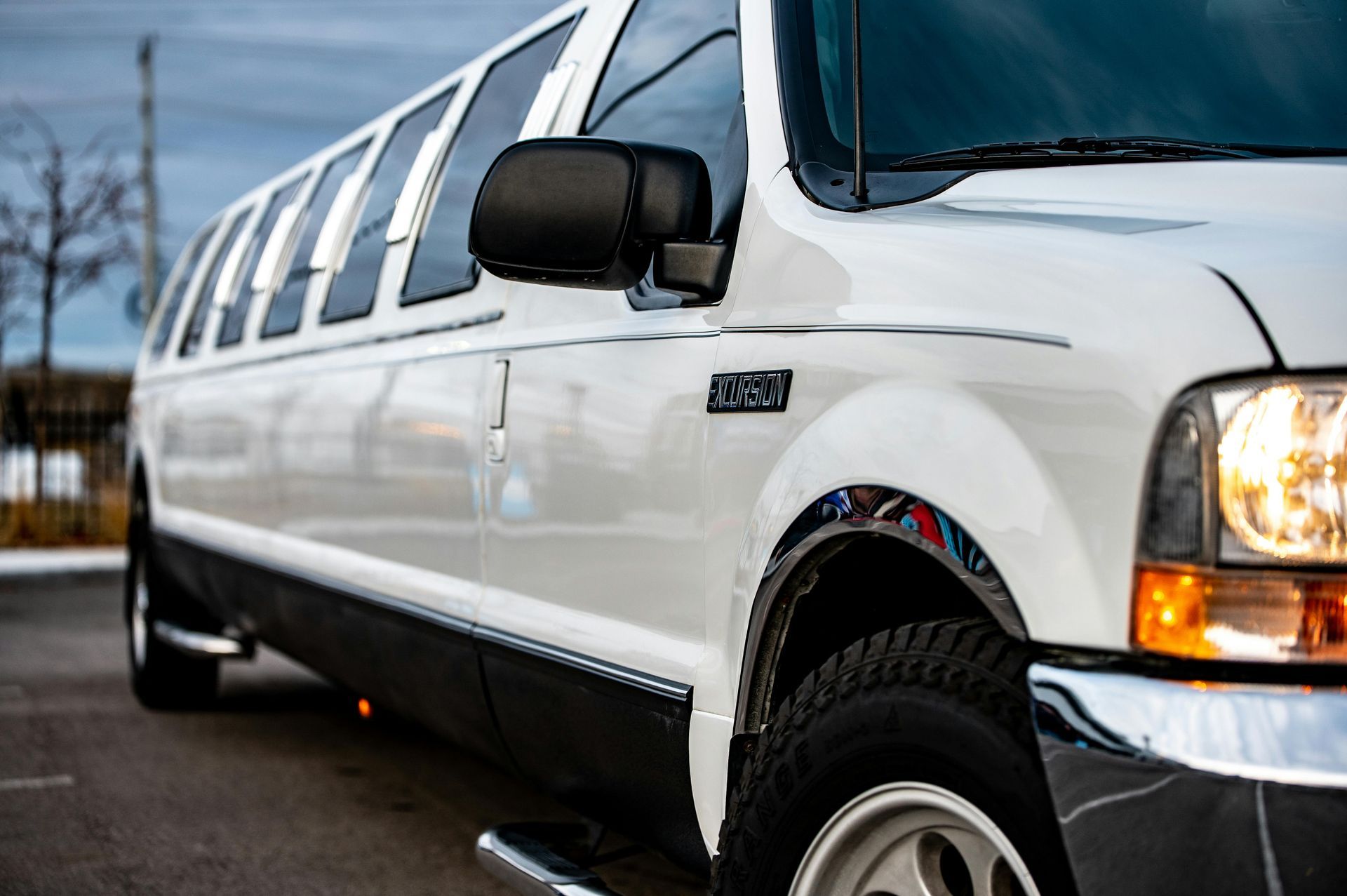 White limousine on a paved road, on the way to attend an Atlanta celebration