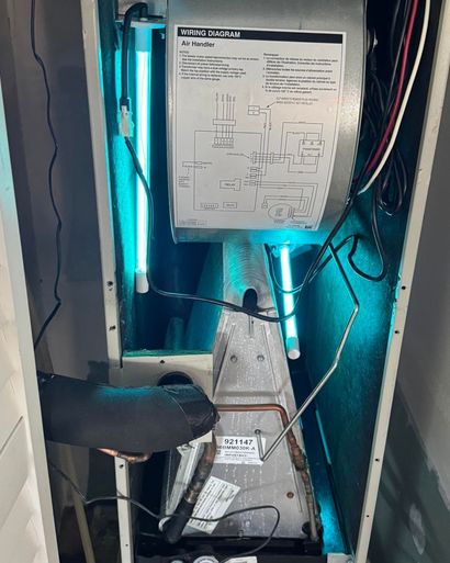 Blue UV lamp inside a metallic machine chamber