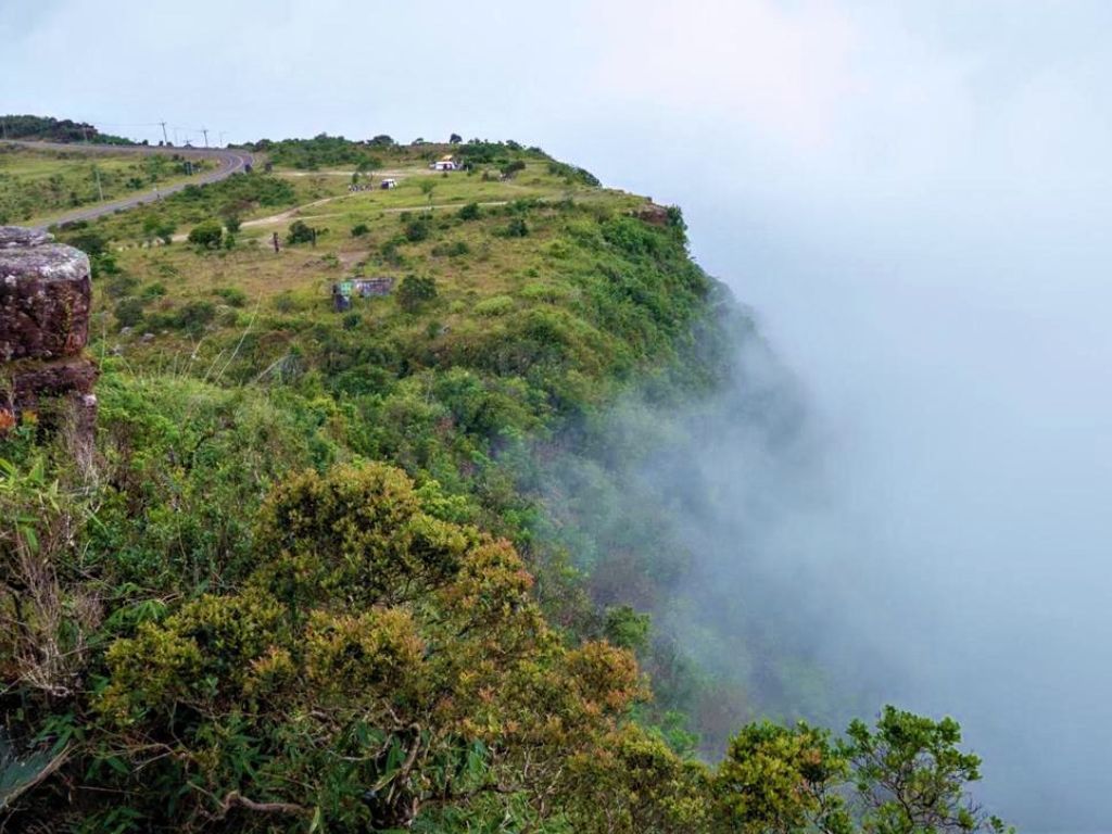 Private Bokor National Park day tour from Phnom Penh, featuring misty mountains, waterfalls, and historic French colonial buildings