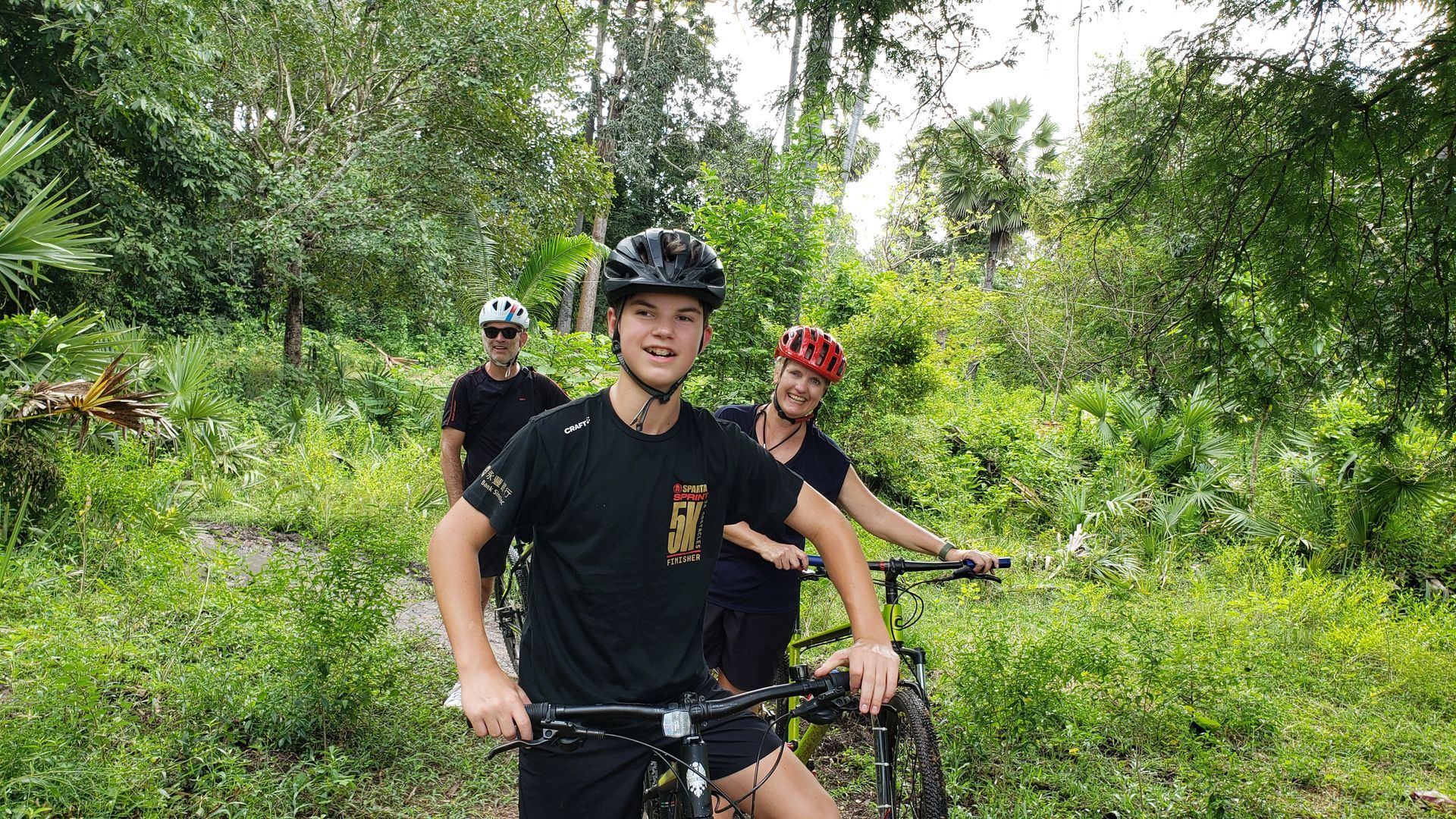 Private Angkor jungle biking tour through ancient temples, forest trails, and Cambodian countryside led by a local cycling guide.