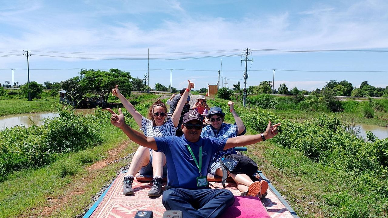 Traveler exploring Angkor Wat during the Best of Cambodia 15 Days Tour featuring temples, cities, and cultural landmarks.