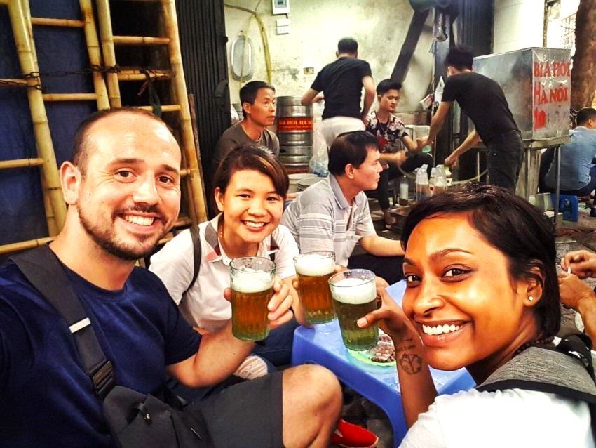 Private Siem Reap street food tour by tuk-tuk with local guide serving traditional Khmer dishes at night market stalls.
