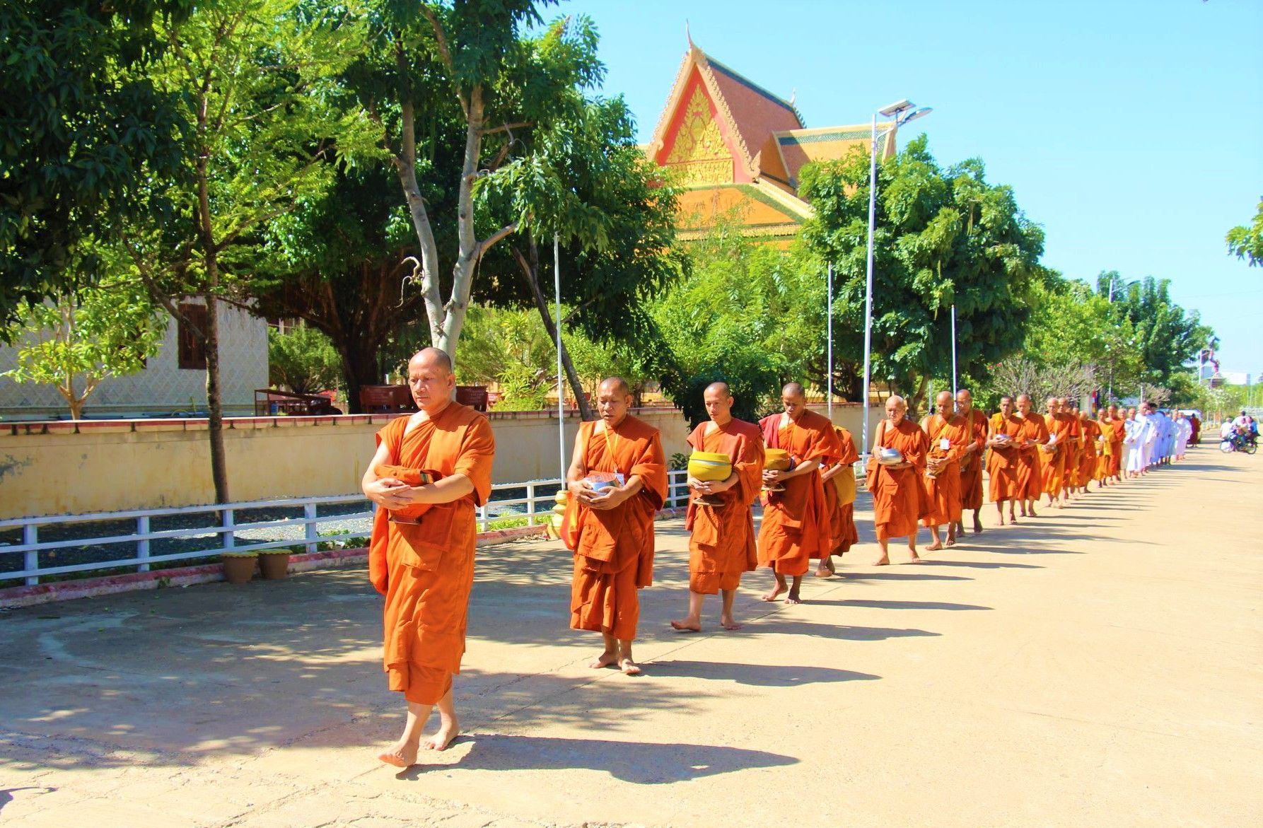 Tourists riding the famous bamboo train in Battambang, a unique adventure in Cambodia tours.