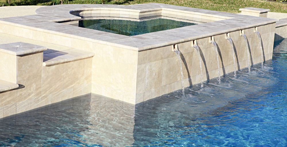 Water Spilling From Spa Into Luxury Swimming Pool — Professional Pool Builder in Gundagai, NSW